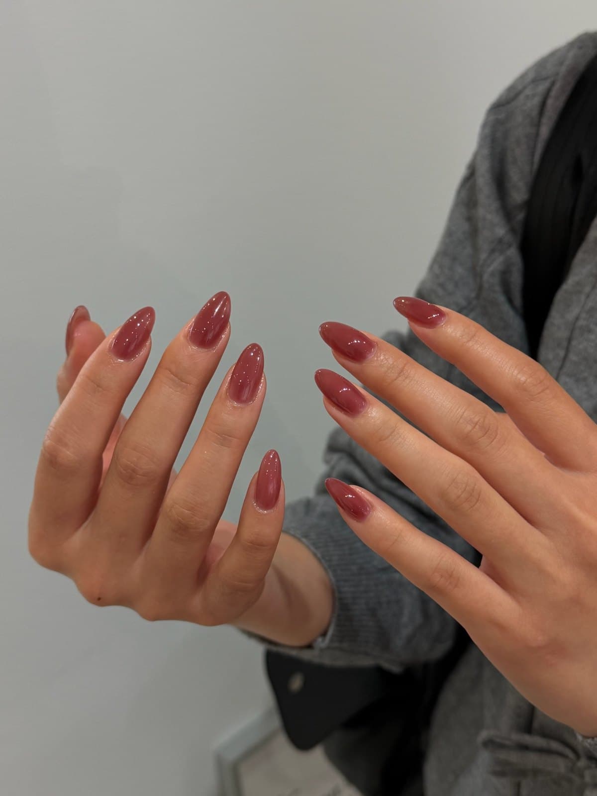 Long almond Korean gel nails in muted rose and brown tones, worn on both hands at Joy Nail Studio Vancouver