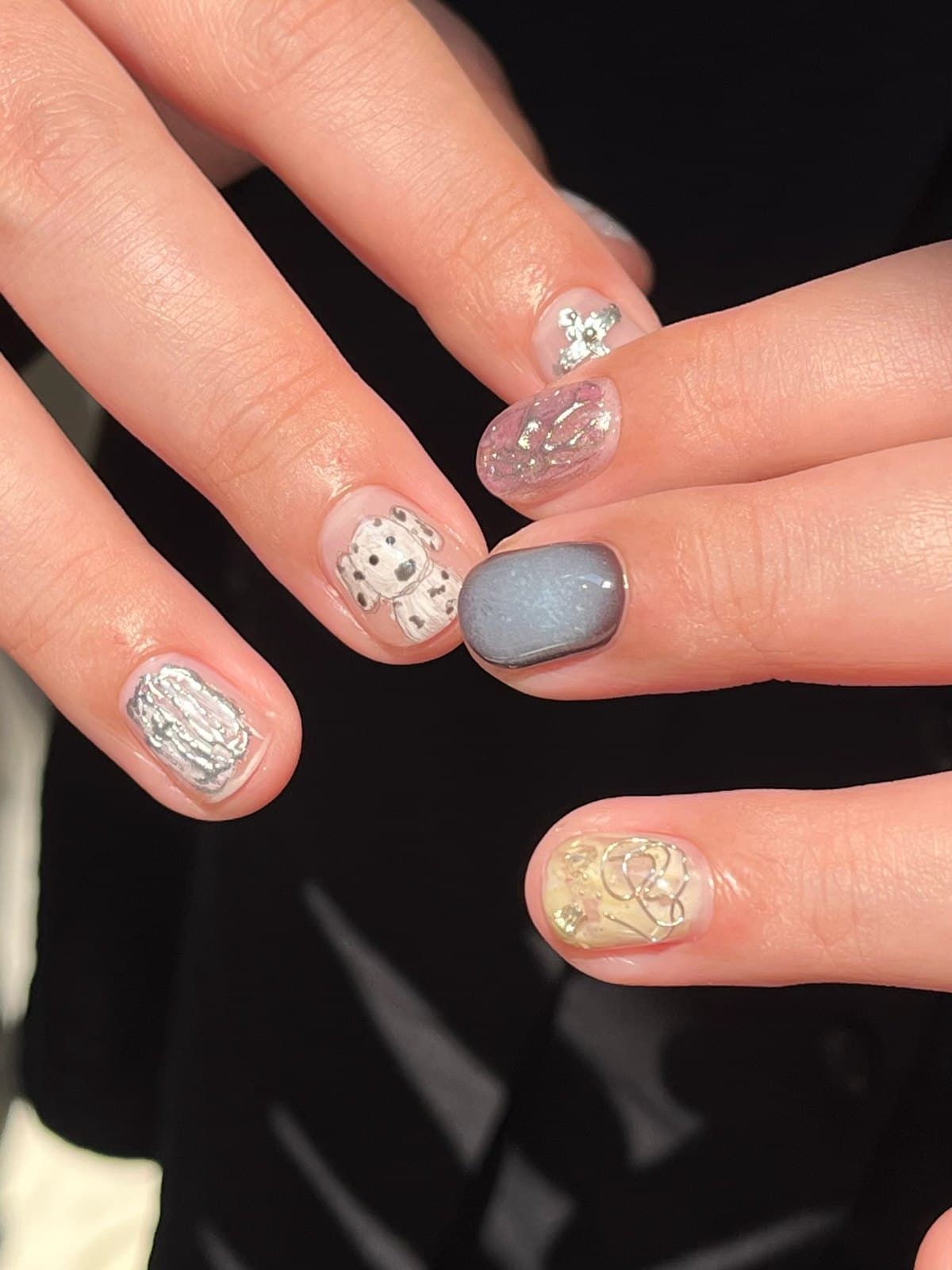 Gel nails in blue-grey and gold with textured relief art at Joy Nail Studio Vancouver