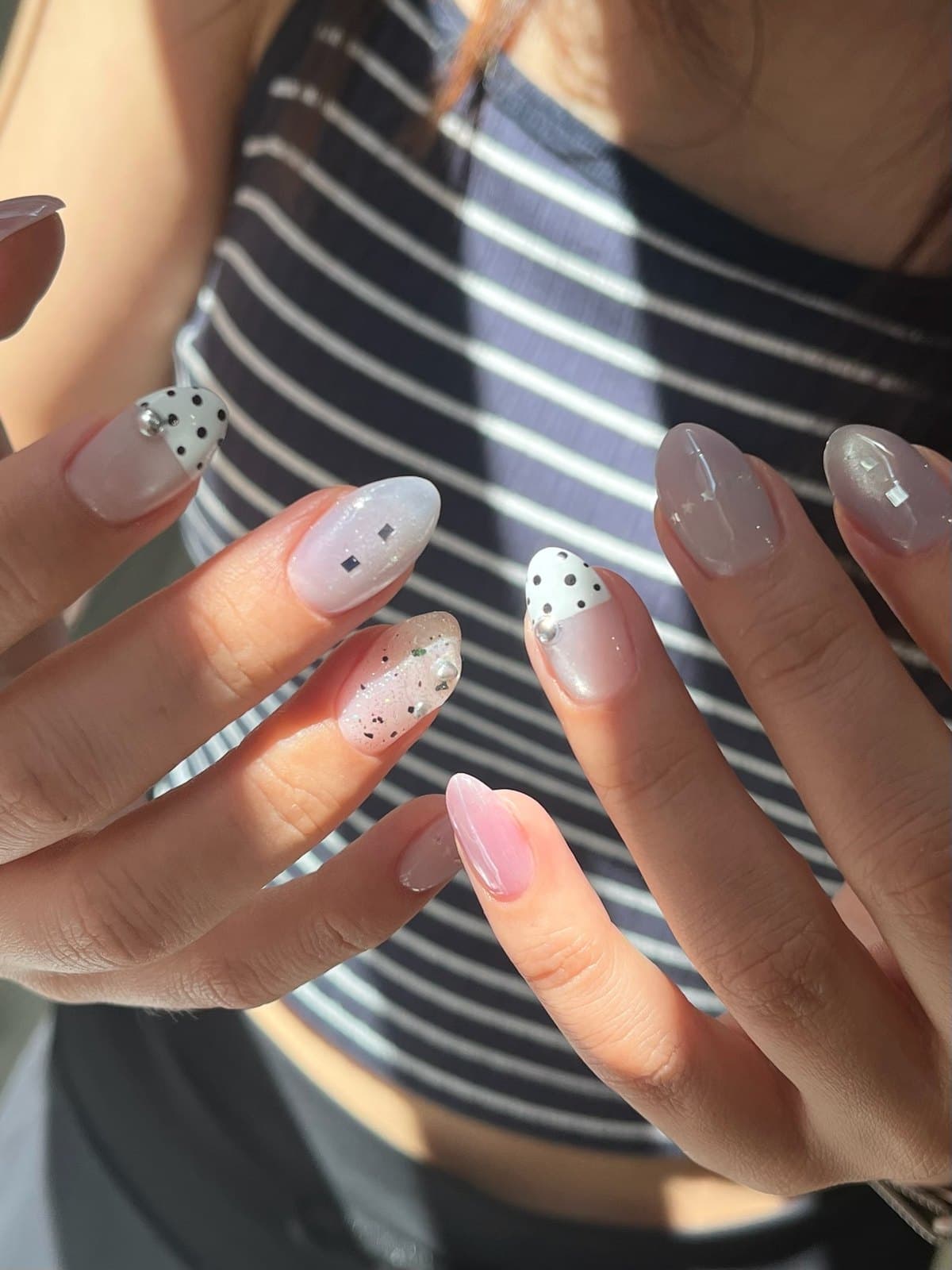 Gel nails in grey and mauve with pearl studs and dot detail at Joy Nail Studio Vancouver