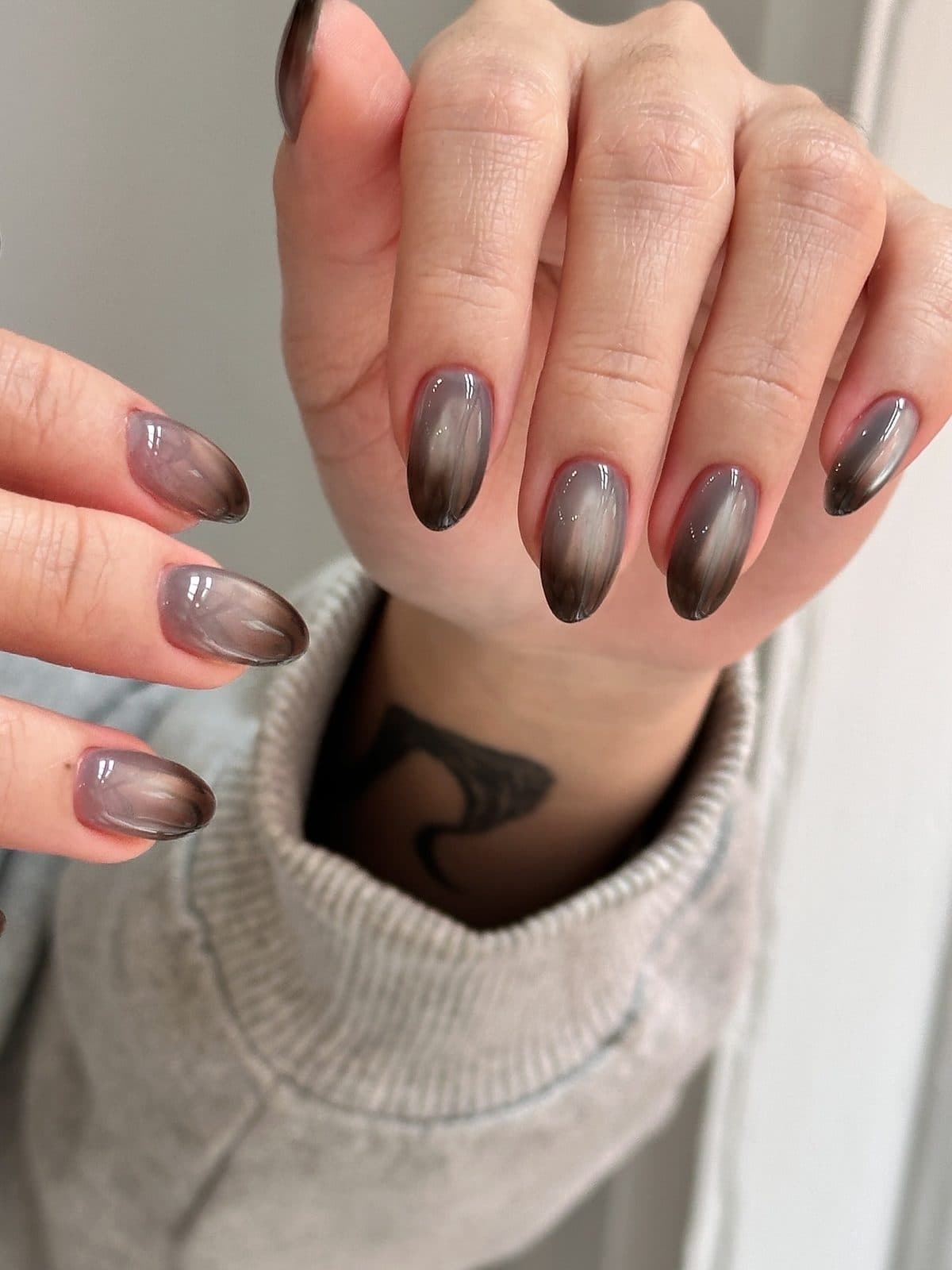 Long almond gel nails in a dark brown cat-eye ombre at Joy Nail Studio Vancouver