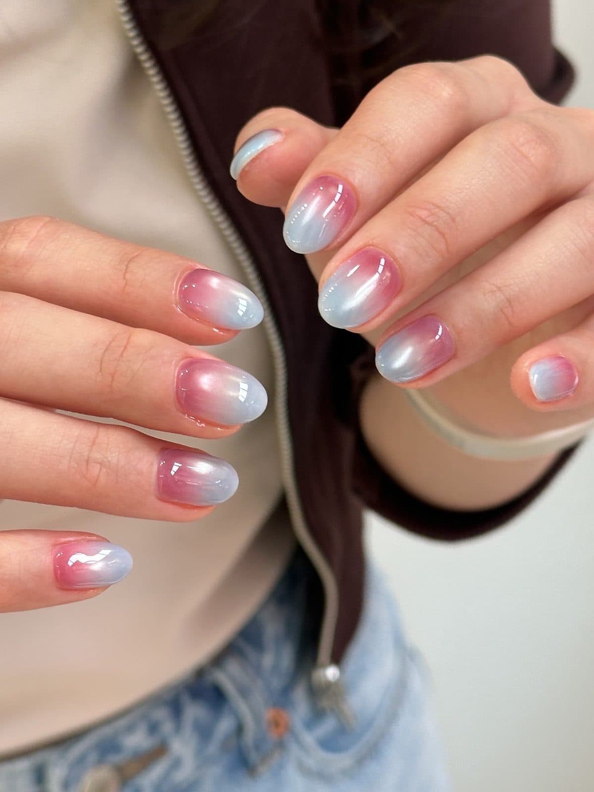 Round gel nails in a pink and blue pearl ombre at Joy Nail Studio Vancouver