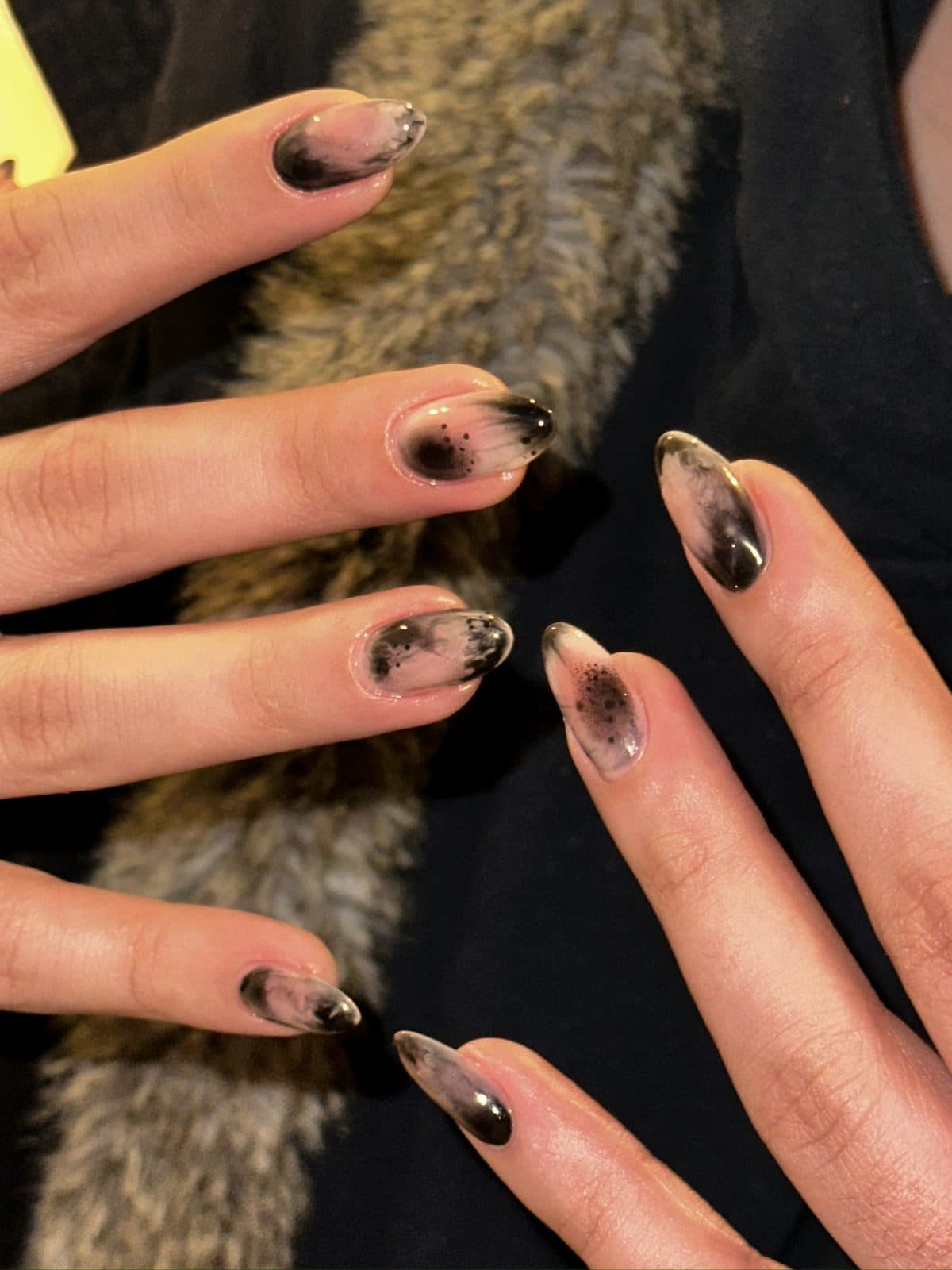 Almond gel nails with a smoky black and brown French ombre at Joy Nail Studio Vancouver