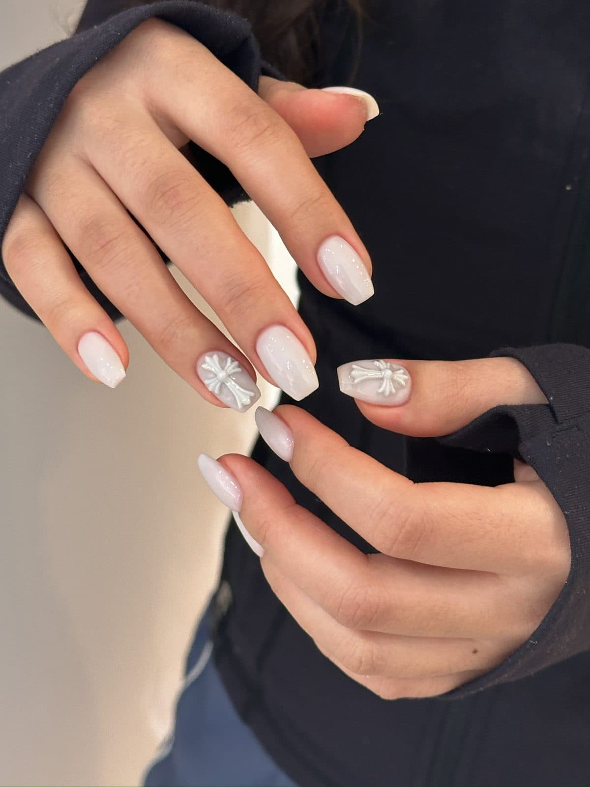 Long coffin gel extensions in milky white with 3D relief art at Joy Nail Studio Vancouver