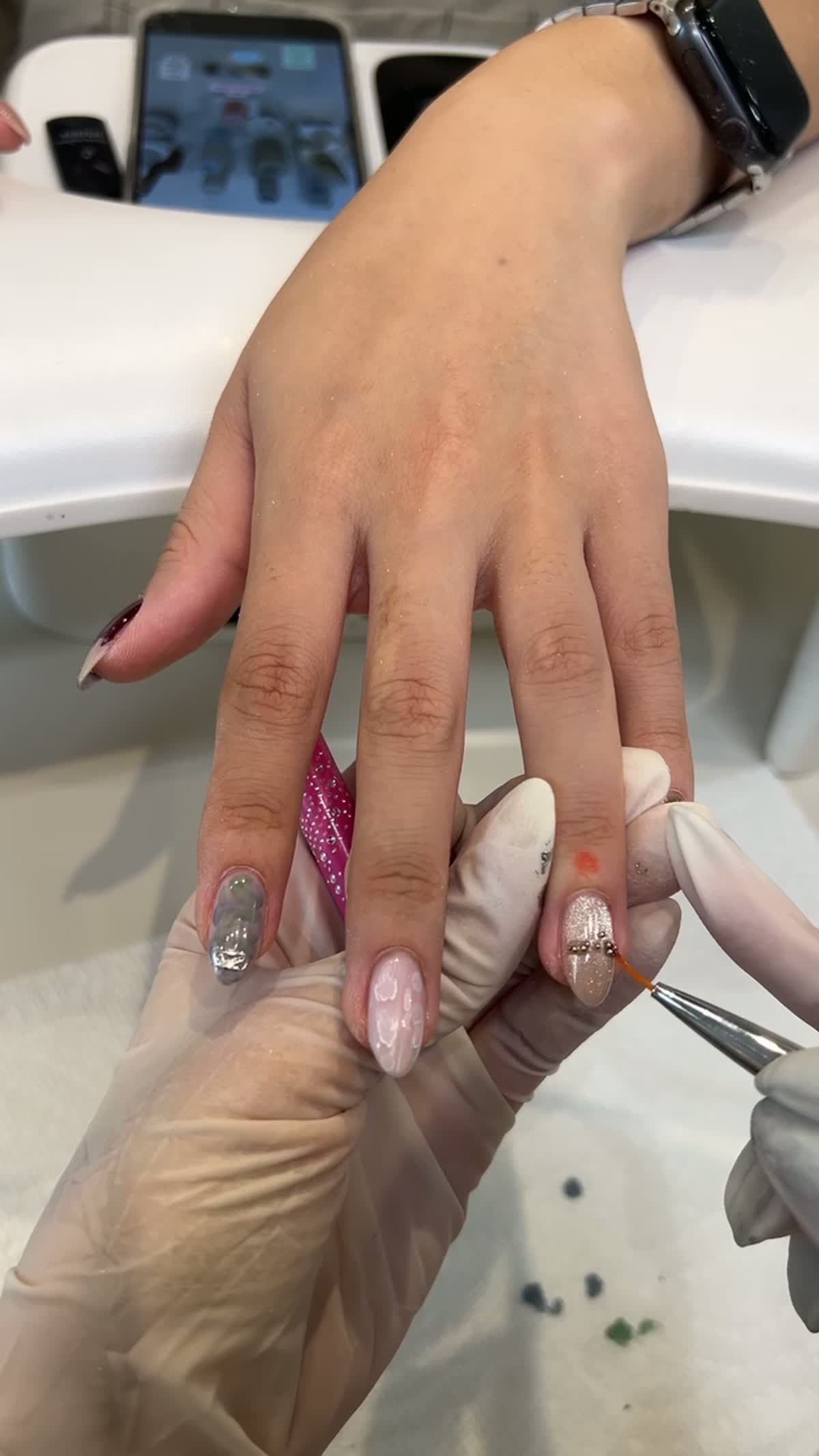 Close-up of September gel nail art being hand-painted at Joy Nail Studio Vancouver