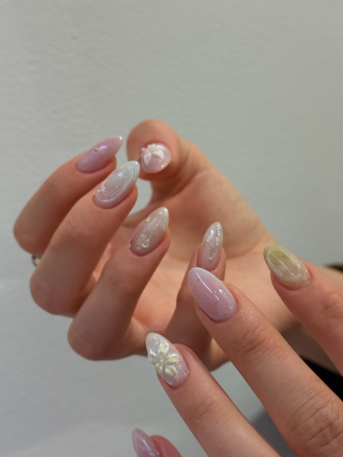Pearl pink glazed Korean gel nails with 3D flower detail by Joy Nail Studio Vancouver