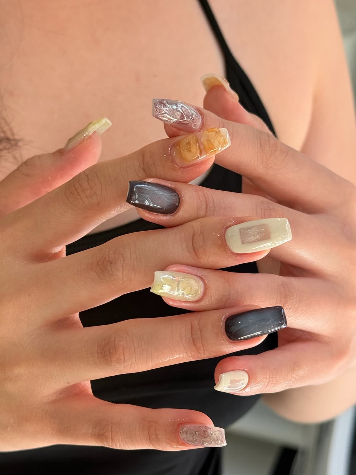 Long square Korean gel nails mixing grey cat-eye, amber marble and cream designs by Joy Nail Studio Vancouver